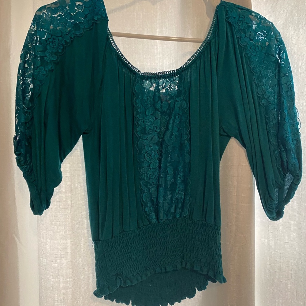 Stunning teal crop top with lace detail! Perfect for a holiday party!